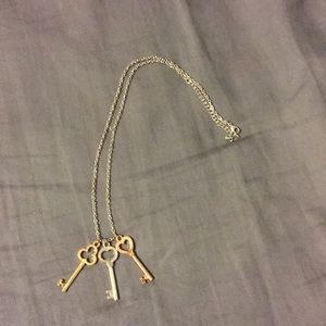 Cute necklace.Keys are gold, silver, and rose gold
